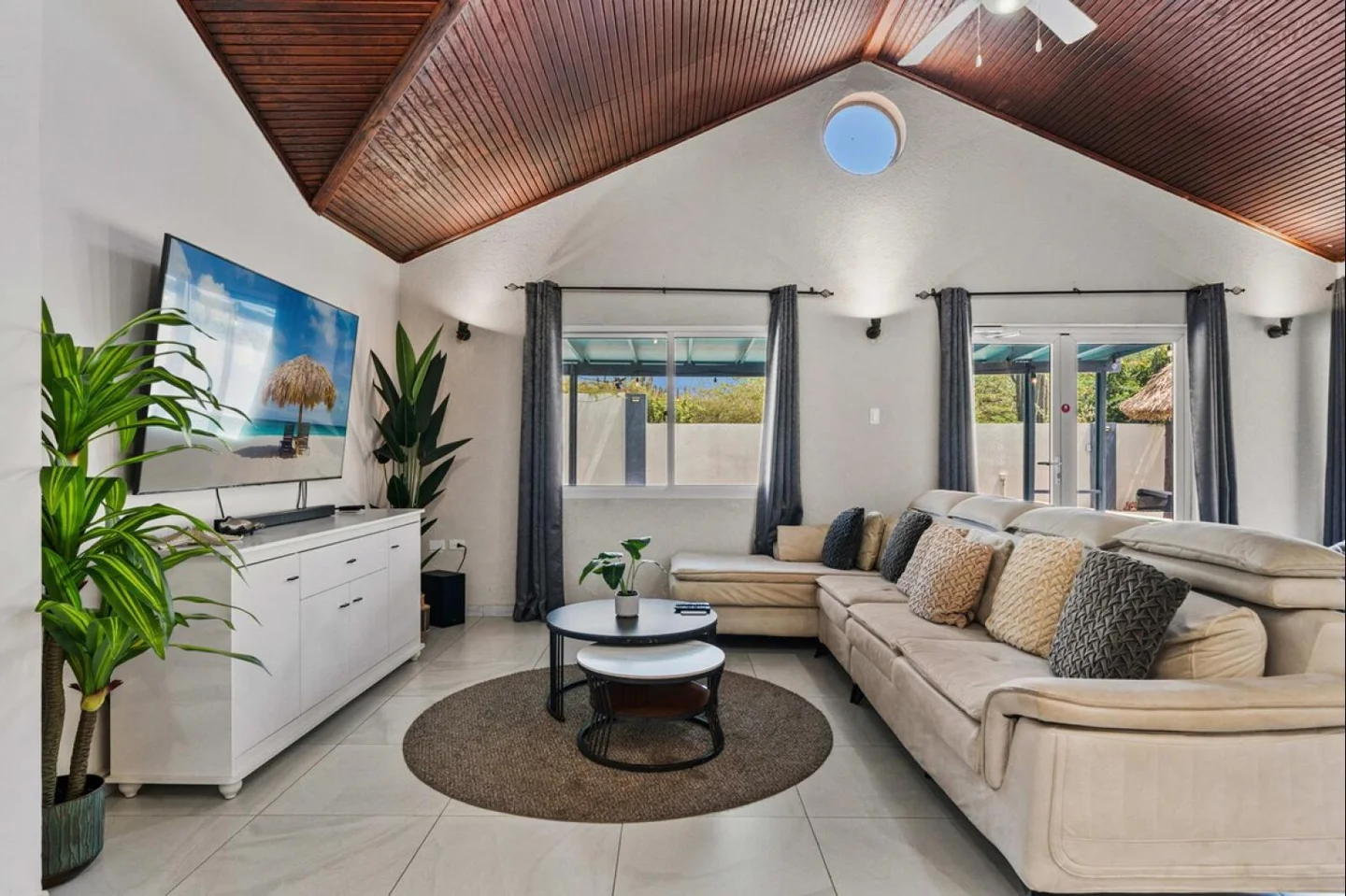 Open living room with vaulted wood ceiling